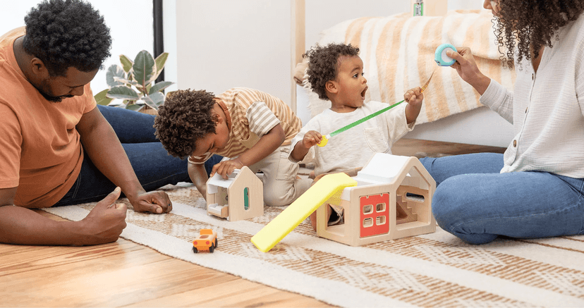 Siblings playing with the Modular Playhouse from The Observer Play Kit